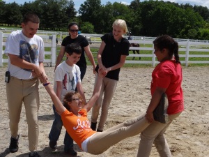 Emily being picked up after falling in the Down and Out Class